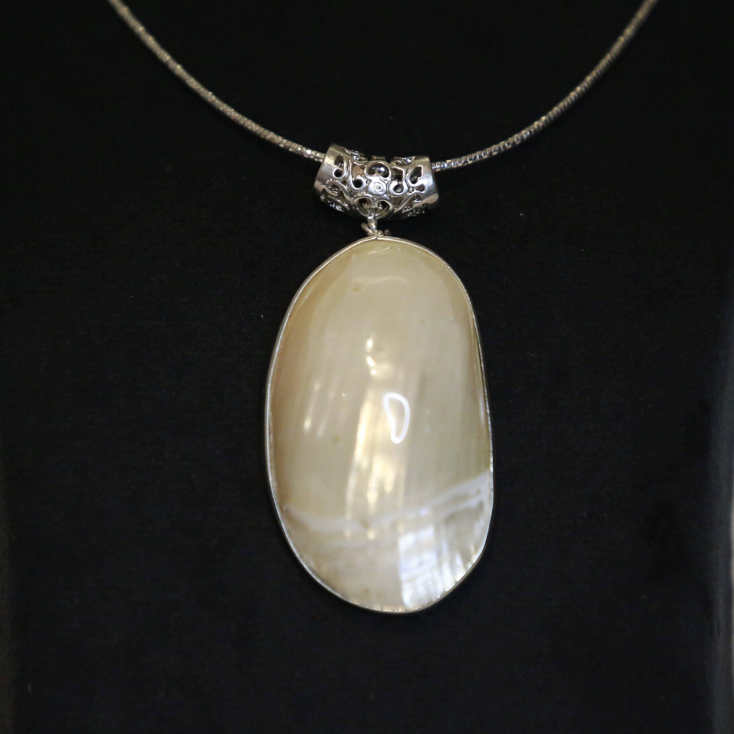 Exquisite Mother of Pearl Pendant With A Filigree Clasp