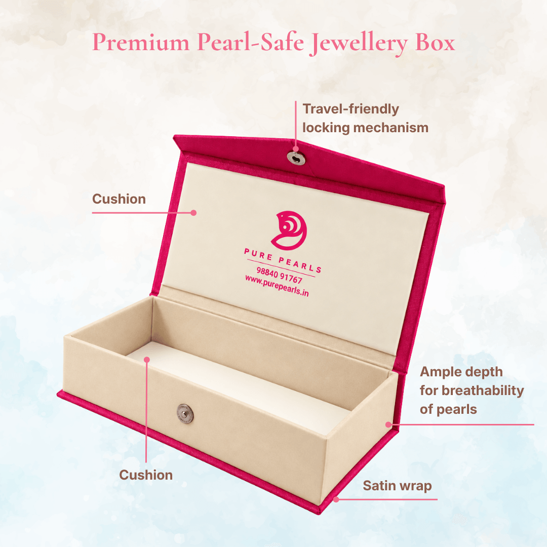 Pure Pearls pink and cream jewellery box with a cushioned interior, satin wrap and locking closure.