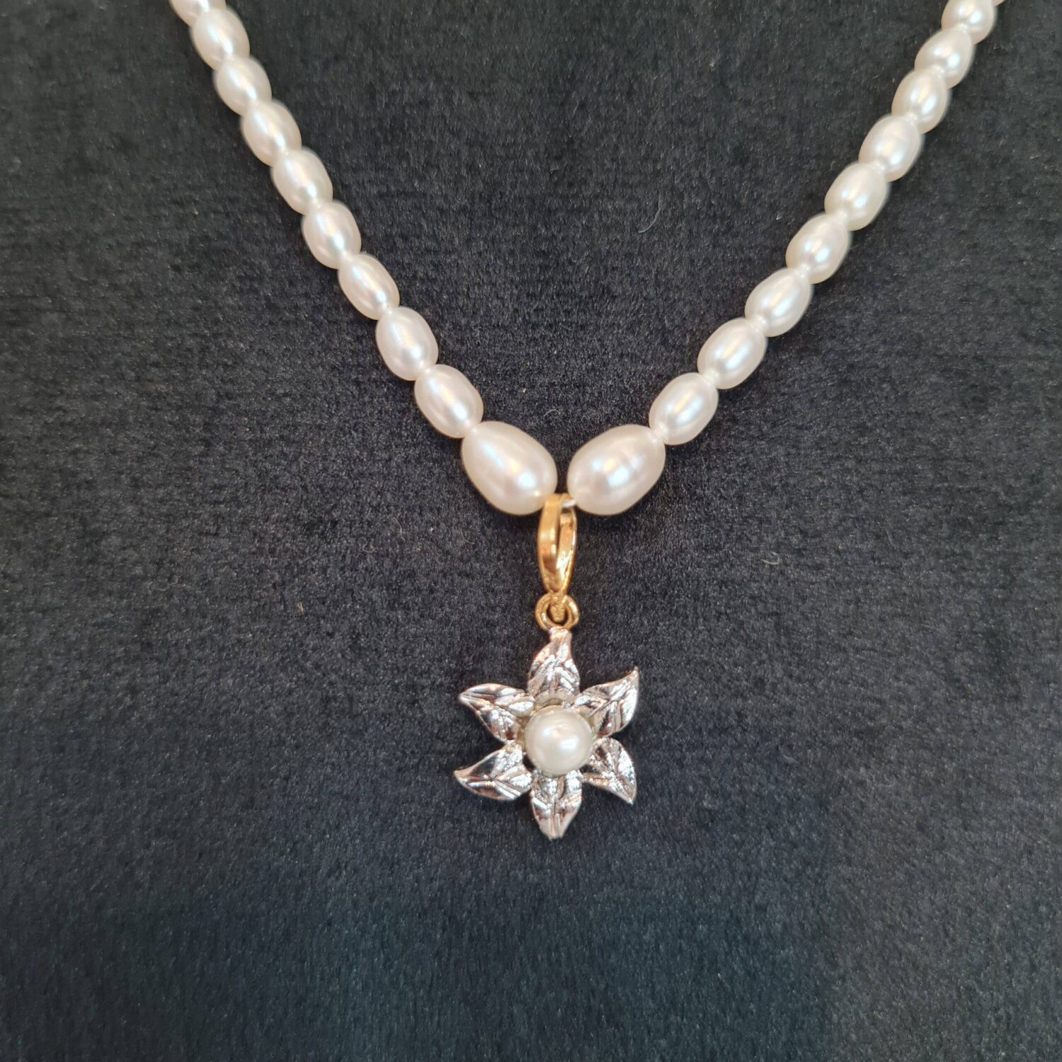 Pretty White Oval Pearl 15Inch Necklace With A Cute Floral Rhodium Finish Pendant - Image 2