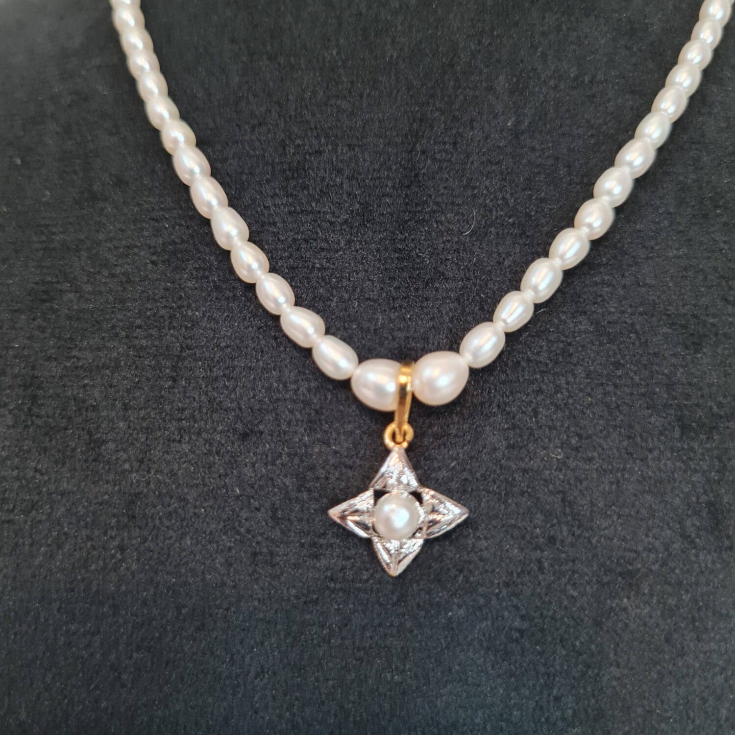 Dainty White Oval Pearl 15Inch Necklace With A Starry Rhodium Finish Pendant - Image 2