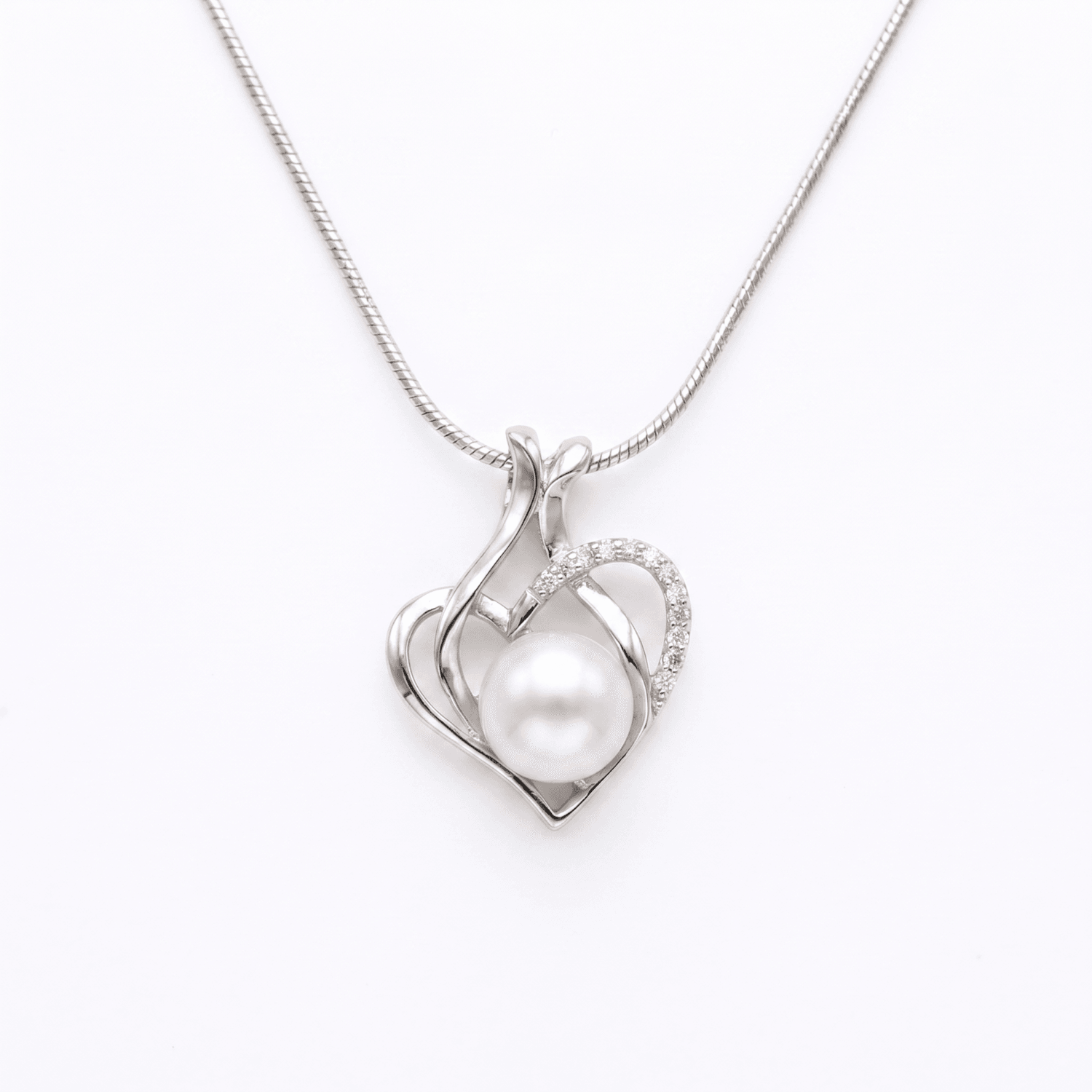 Lovely CZ Heart Pendant Accentuated With Peach Button Pearl