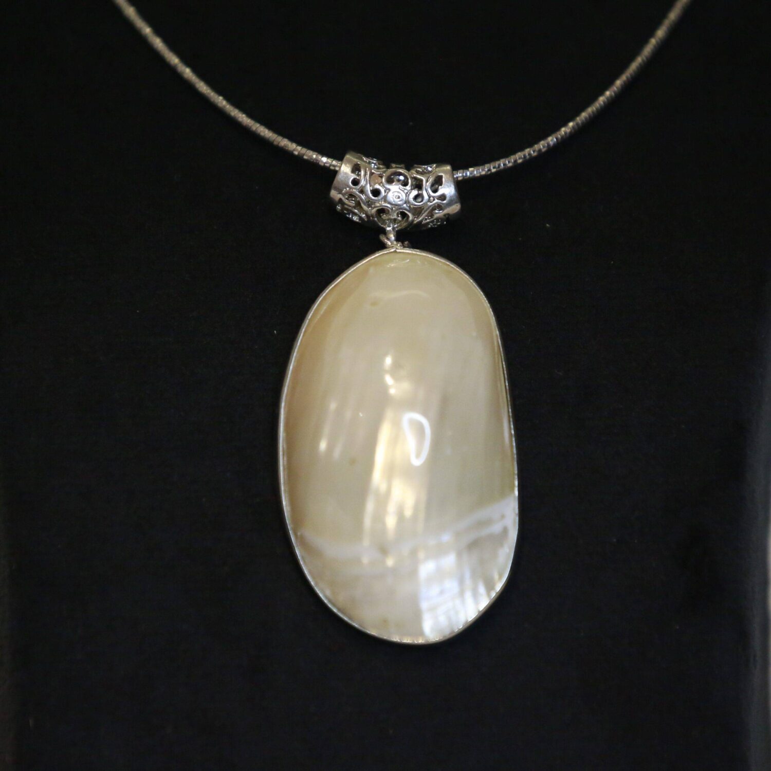 Exquisite Mother of Pearl Pendant With A Filigree Clasp