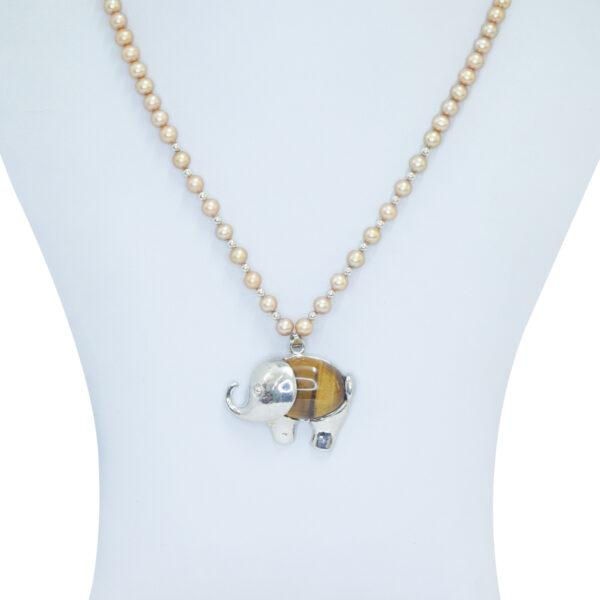 Well crafted round golden pearl necklace set with SP tiger eye elephant pendant - close up