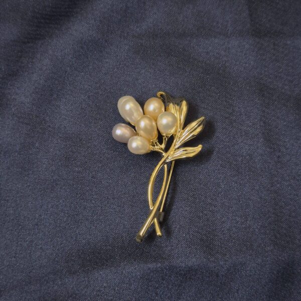 Elegant Floral Brooch Enhanced With Multicoloured Oval Pearls